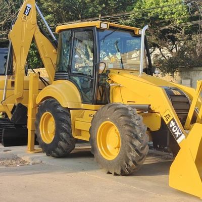 74.6kW JCB 4CX używany ładowarka Żółty 4378kg Podnoszenie używany ładowarka wyciągów Koło w ruchu
